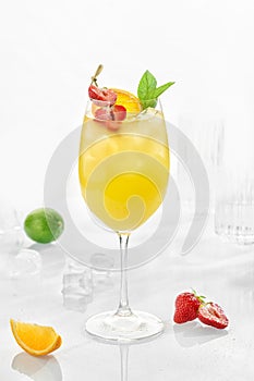 Classic lemonade mix in glass on white background with Mandarin puree, Philippine lime puree, kumquat, sugar syrup, sparkling