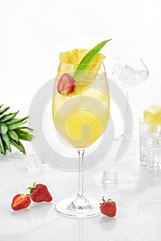 Classic lemonade mix in glass on white background with Pineapple puree, quince syrup, sparkling water, lemon