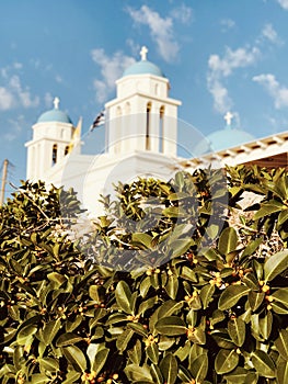 A classic light blue and white church in Paros Greece basks in the Greek Sunshine