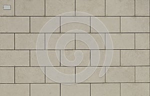 Classic light gray rectangle granite tiles of exterior wall facade