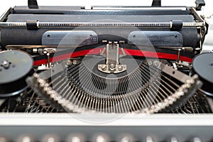 Classic, manual typewriter in white with a German keyboard layout, isolated on a white background with a clipping path.