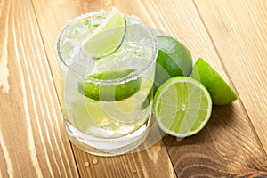 Classic margarita cocktail with lime and salty rim