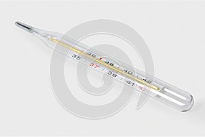 Classic Medical glass mercury thermometer for measuring body temperature isolated on a white background