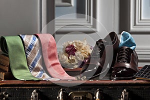Classic men fashionable accessories on table. classic men`s shoes and ties