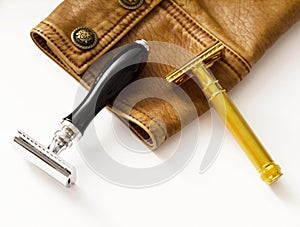 Classic men's razors placed on leather jacket