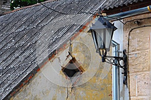 Classic metal lantern on grunge wall background