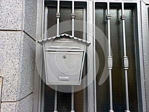 Classic metal mailbox on residential gate for security and style