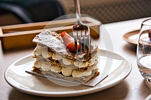 Classic milfey cake with cream in the bowl