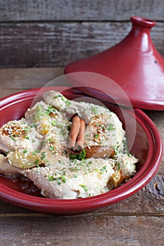 Classic Moroccan chicken tagine with caramelized pears, cinnamon