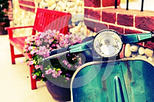 Classic motorcycle with red bench