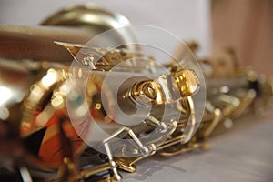 Classic musical instrument saxophone gold color close up detail texture