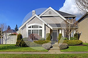 Classic new American house exterior in the spring.