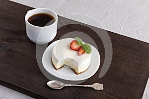 Classic New York cheesecake and cup of coffee. Creamy dessert