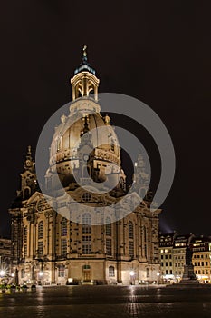 Classic nightshot of Dresden`s Frauenkirche, illuminated by spotlights. photo