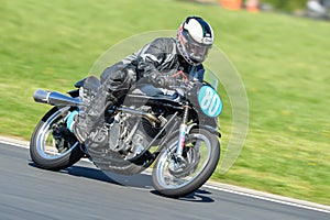 Classic Norton motorcycle on a race track