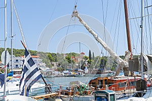 Classic old yacht with varnished wooden cabin and spars