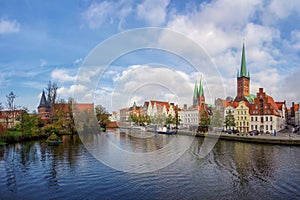 Classic panoramic view of historic skyline of hanseatic town of Lübeck with famous St. Mary`s Church