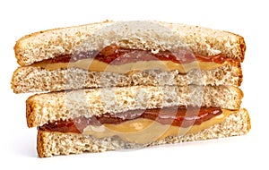A Classic Peanut Butter and Strawberry Jelly Sandwich on Wheat B