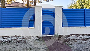 Classic pedestrian blue door metal home gate at entrance of house portal garden Aluminum