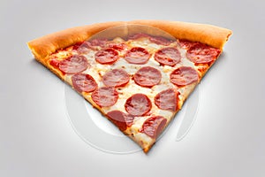 Classic pepperoni pizza slice on white table background.