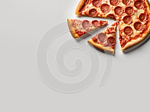 Classic pepperoni pizza on white table background.