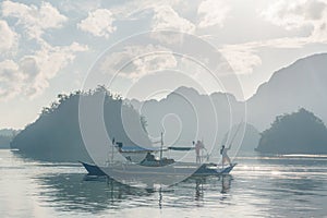 Classic Philippine fishing boat on the background of the sea landscape.