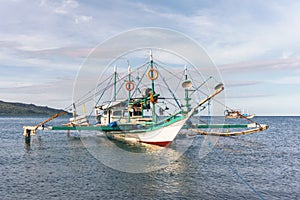 Classic Philippine fishing boat on the background of the sea landscape.