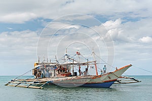 Classic Philippine fishing boat on the background of the sea landscape.