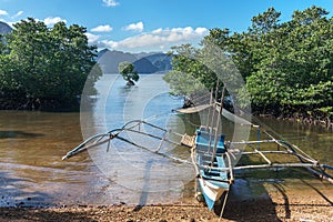 Classic Philippine fishing boat on the background of the sea landscape.