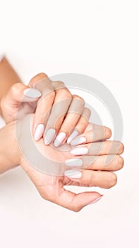 Classic pink wedding nail manicure on white backdrop. Spa treatment concept