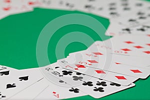 Classic playing cards on green background. Gambling and casino concept.