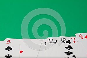 Classic playing cards on green background. Gambling and casino concept.