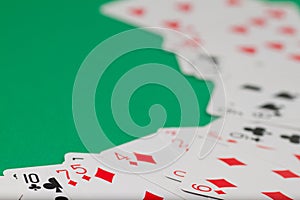 Classic playing cards on green background. Gambling and casino concept.