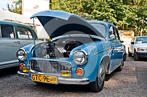 Classic old vintage veteran retro blue Polish car Syrena 104 with open engine compartment