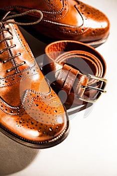 Classic polished men's brogues and brown belt photo