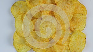 Classic potato chips rotate on a white background.