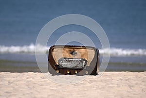 Classic radio on a beach photo