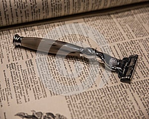 Classic razor on the book sheets