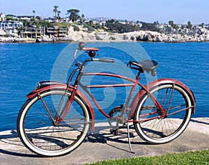 Classic red bicycle at park
