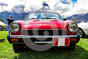 Classic red car during antique cars show