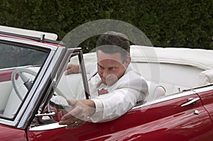 Classic red convertible and driver