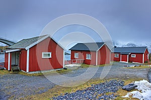 Classic Red Houses In One of the Streets of Traditional Norwegian Fishing Hut Village Hamnoy