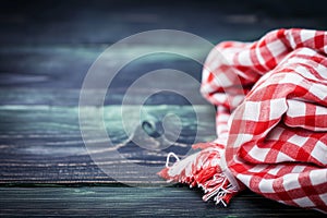 Classic Red and White Checkered Kitchen Towel on Wooden Background