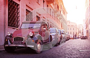 Classic retro car in the narrow old street of european town