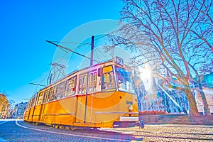 Classic retro styled tram rides in citycenter of Budapest, Hungary