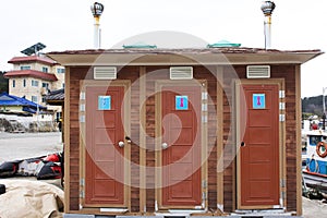 Classic retro vintage building of mobile toilet for korean people and foreign travelers use service restroom at fishery fishing