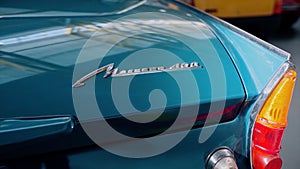 Classic retro or vintage car details. Video. Close up of a trunk and parking lights of a beautiful dark turquoise old