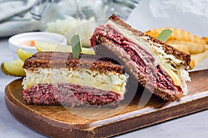 Classic reuben sandwich, served with dill pickle, potato chips, horizontal