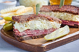 Classic reuben sandwich, served with dill pickle, potato chips, horizontal