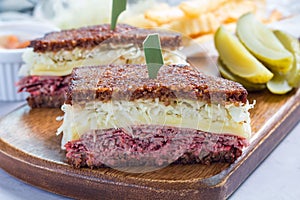 Classic reuben sandwich, served with dill pickle, potato chips, horizontal